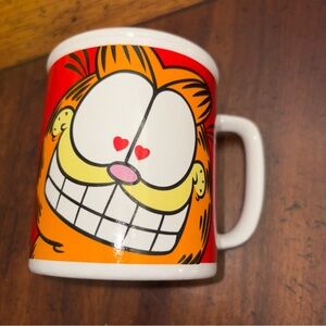 Red and White Coffee Mug with Cartoon Design